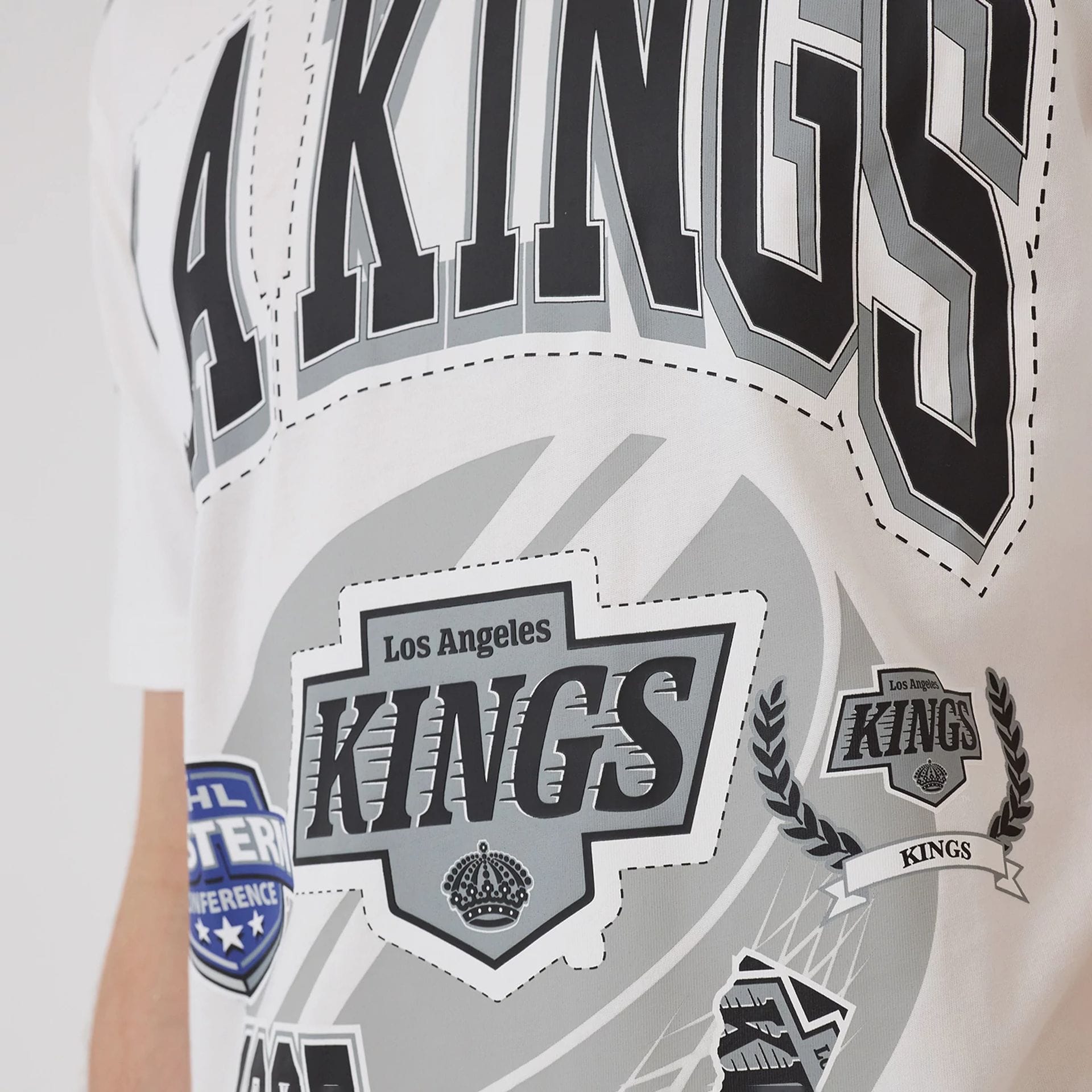 The model is wearing this NHL Sport Classic LA Kings T-Shirt in white. 3
