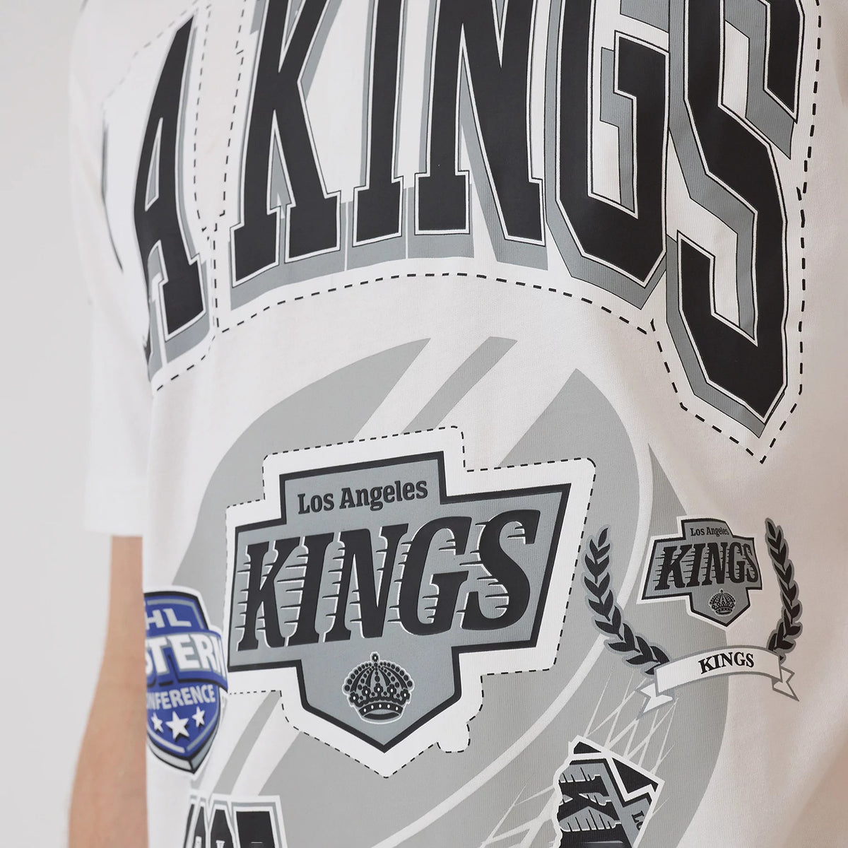 The model is wearing this NHL Sport Classic LA Kings T-Shirt in white. 3