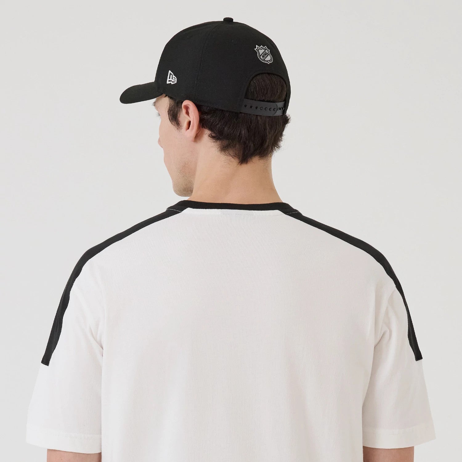 The model is wearing this NHL Sport Classic LA Kings T-Shirt in white. 7