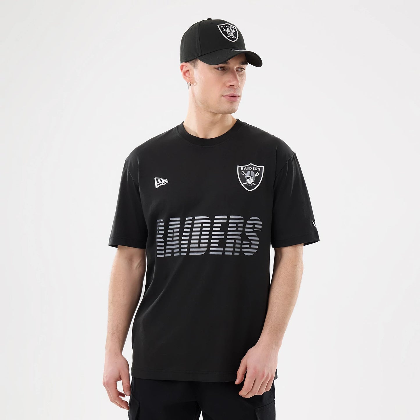 The model is wearing this NFL Match Las Vegas Raiders T-Shirt in black. 1