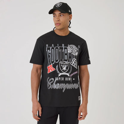 New Era Las Vegas Raiders NFL Sport Classic Black T-Shirt, front view on-model showing a graphic with Raiders helmet, logos and Super Bowl Champions lettering, paired with a black cap featuring an embroidered team logo on the front.