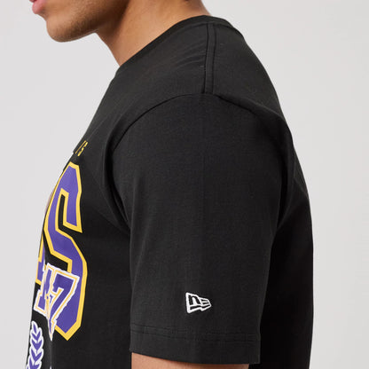 The model is wearing this NBA Sport Classic LA Lakers T-Shirt in black. 5