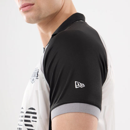 New Era LA Kings NHL Match Black T-Shirt, side view on-model showing the black and grey short sleeves, an embroidered New Era logo on the left sleeve, and part of the team emblem on the chest.