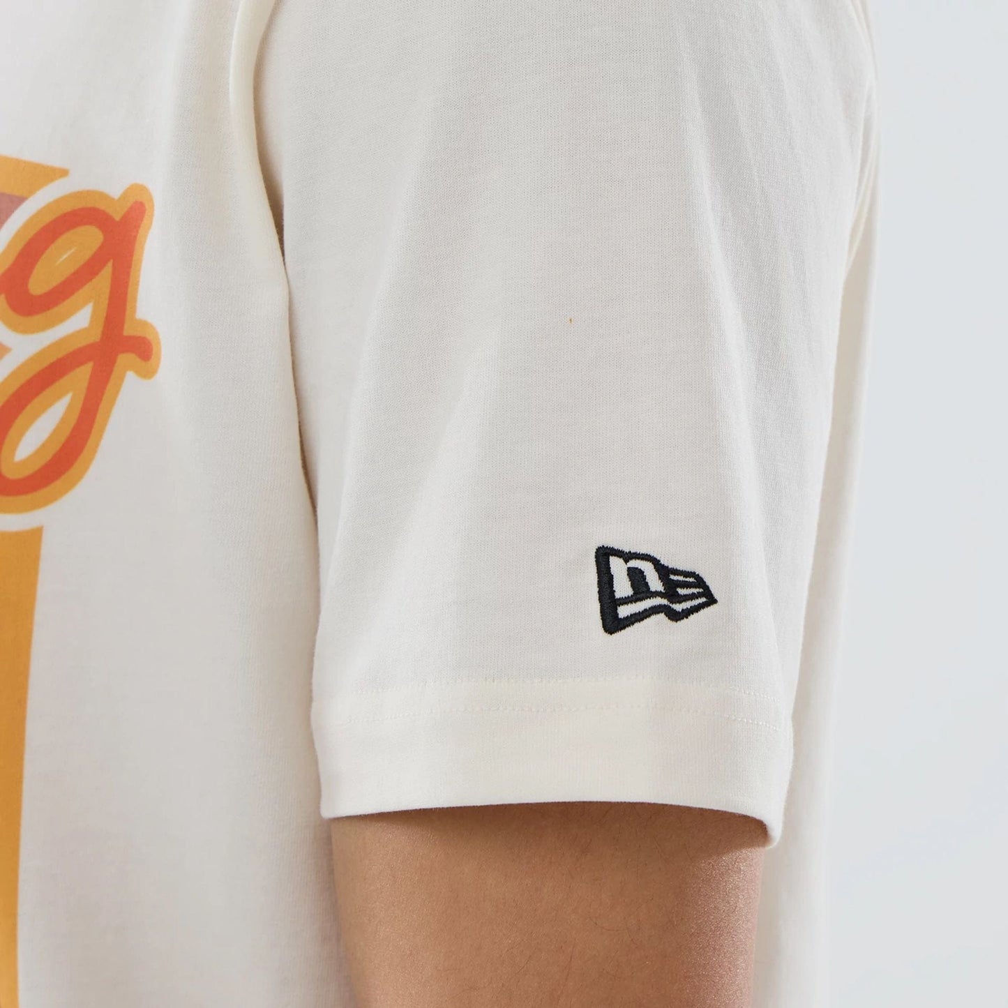 The model is wearing this MLB Spring Training 2026 Cactus League Logo T-Shirt in Cream. 4