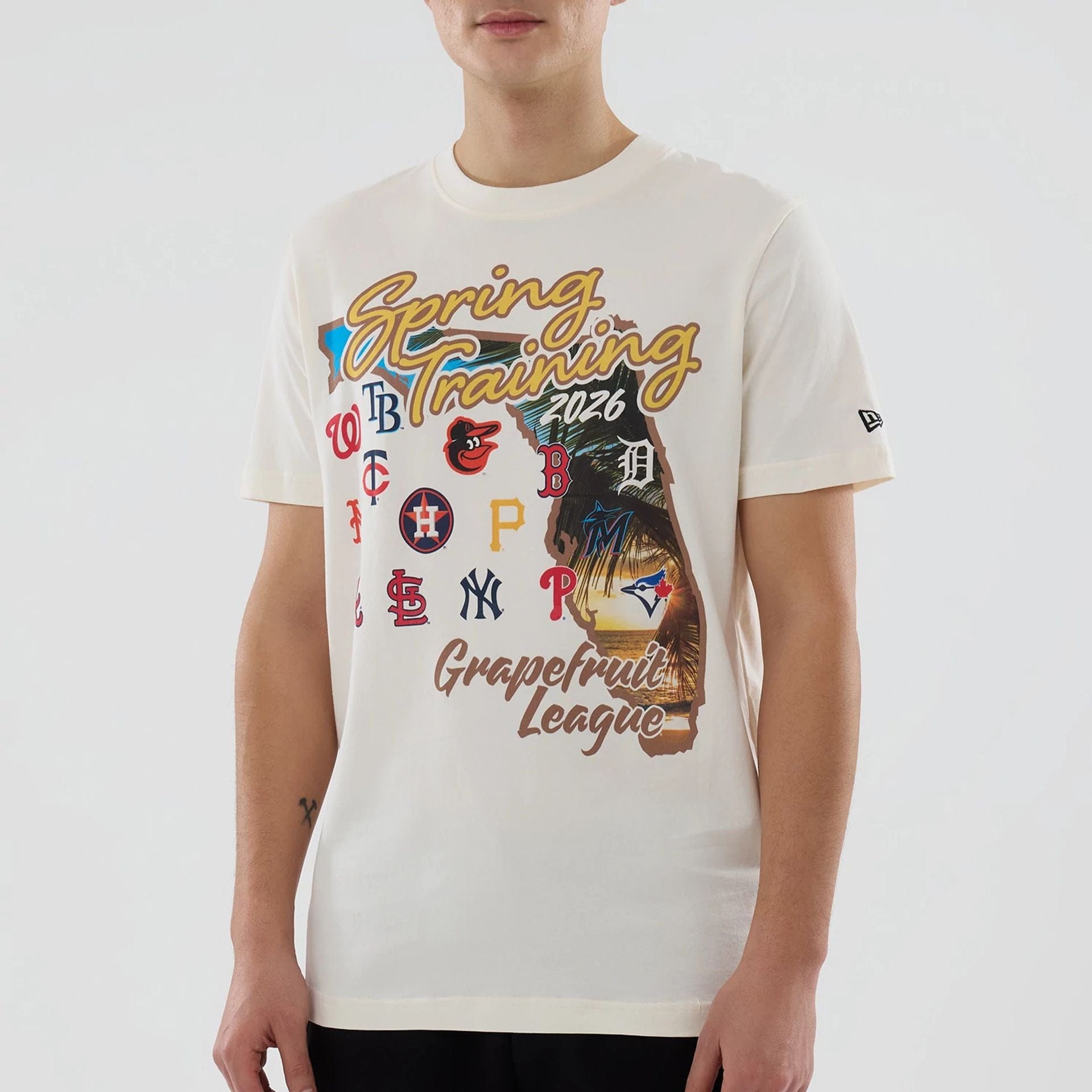 The model is wearing this MLB Spring Training 2026 Grapefruit League Logo T-Shirt in Cream. 4