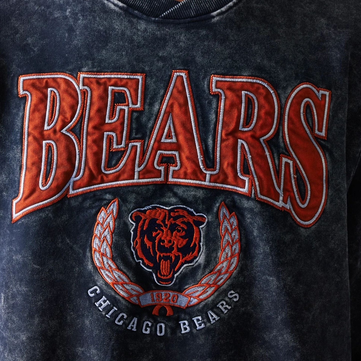 The model is wearing this NFL Chicago Bears Crew Neck Sweater in navy. 3