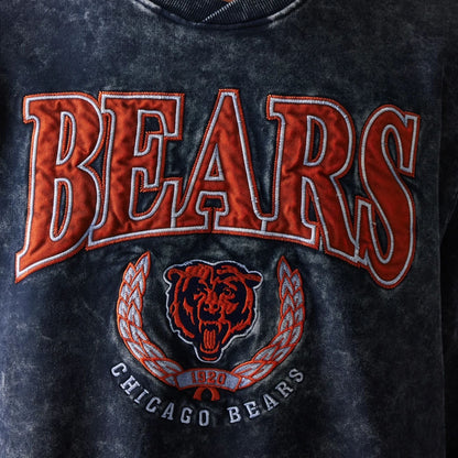 The model is wearing this NFL Chicago Bears Crew Neck Sweater in navy. 3