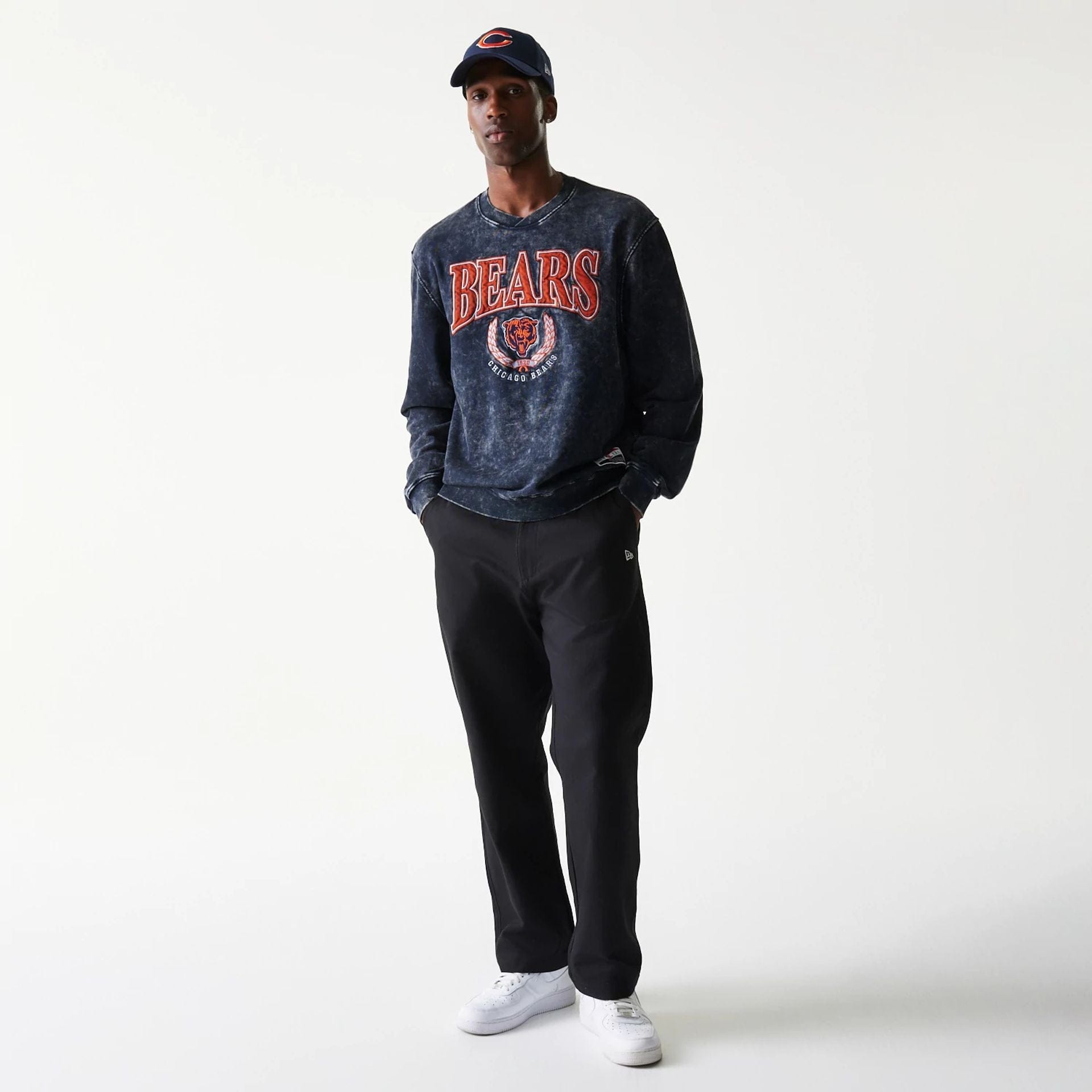 The model is wearing this NFL Chicago Bears Crew Neck Sweater in navy. 6