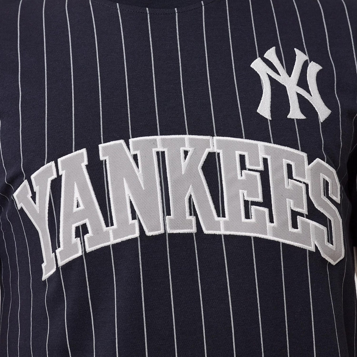 The model is wearing this MLB Pinstripe New York Yankees T-Shirt in navy. 3