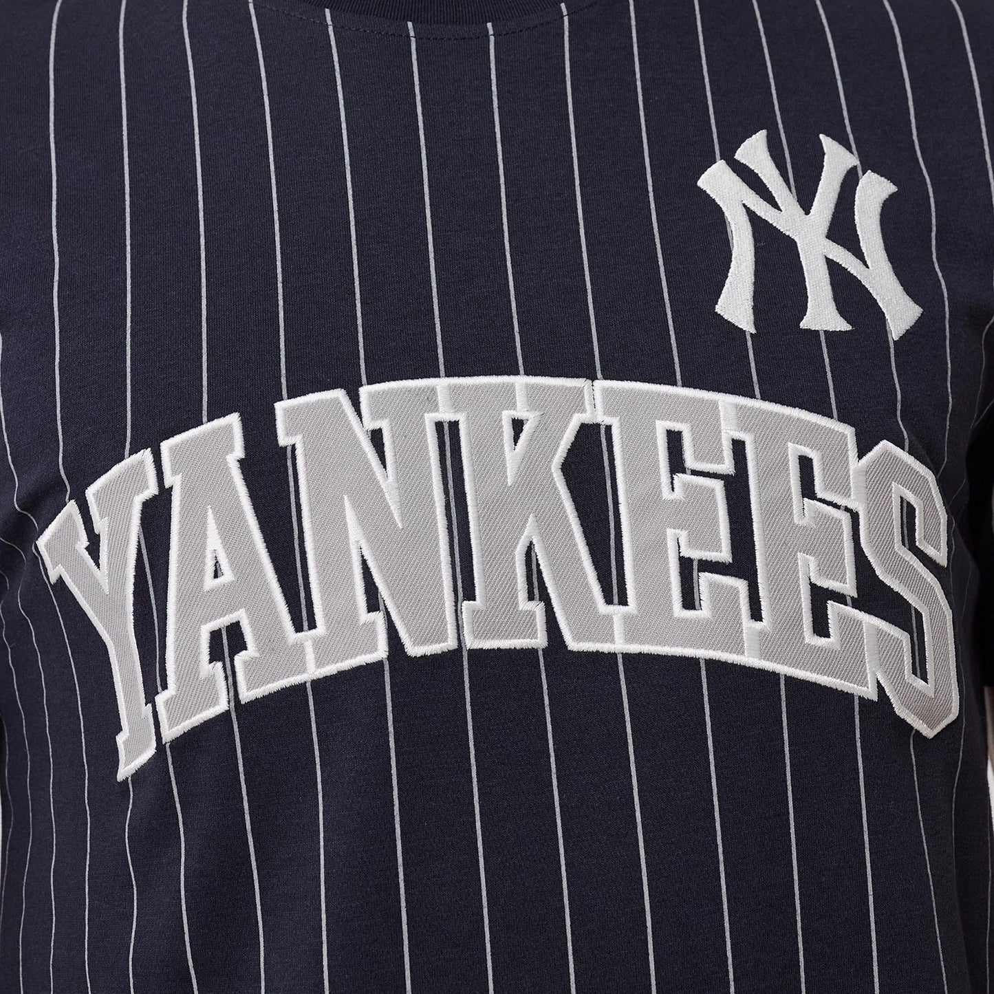 The model is wearing this MLB Pinstripe New York Yankees T-Shirt in navy. 3