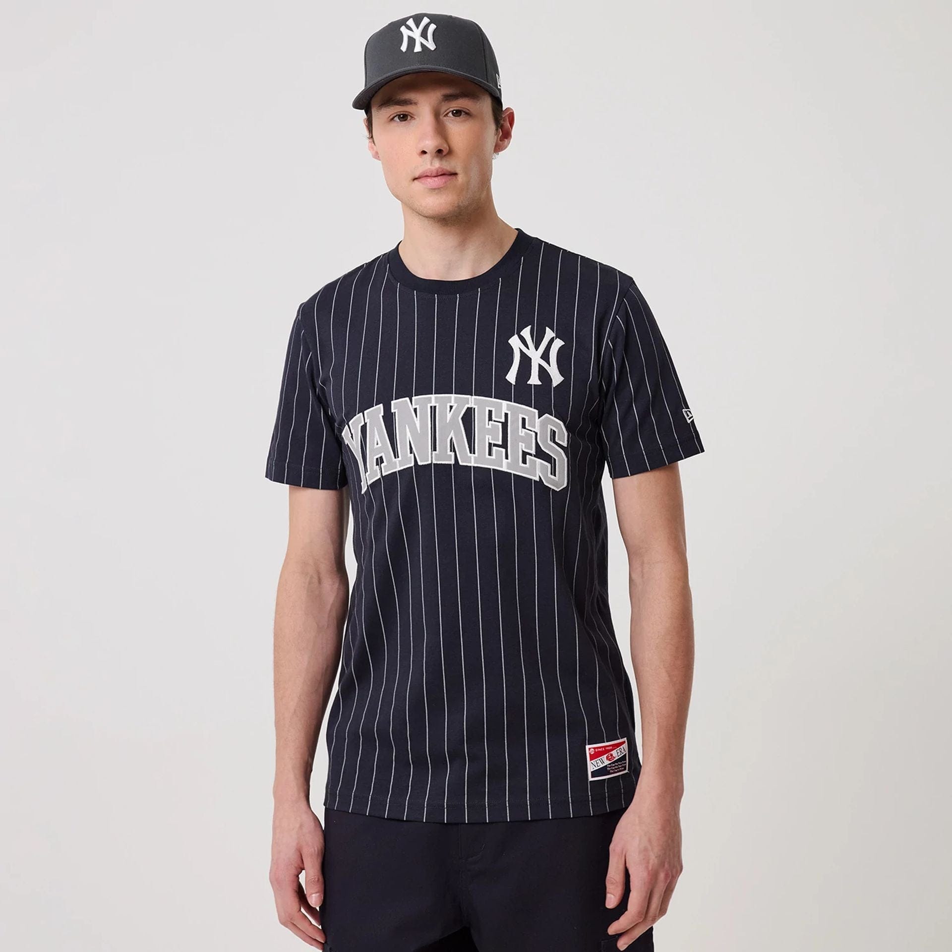 The model is wearing this MLB Pinstripe New York Yankees T-Shirt in navy. 1