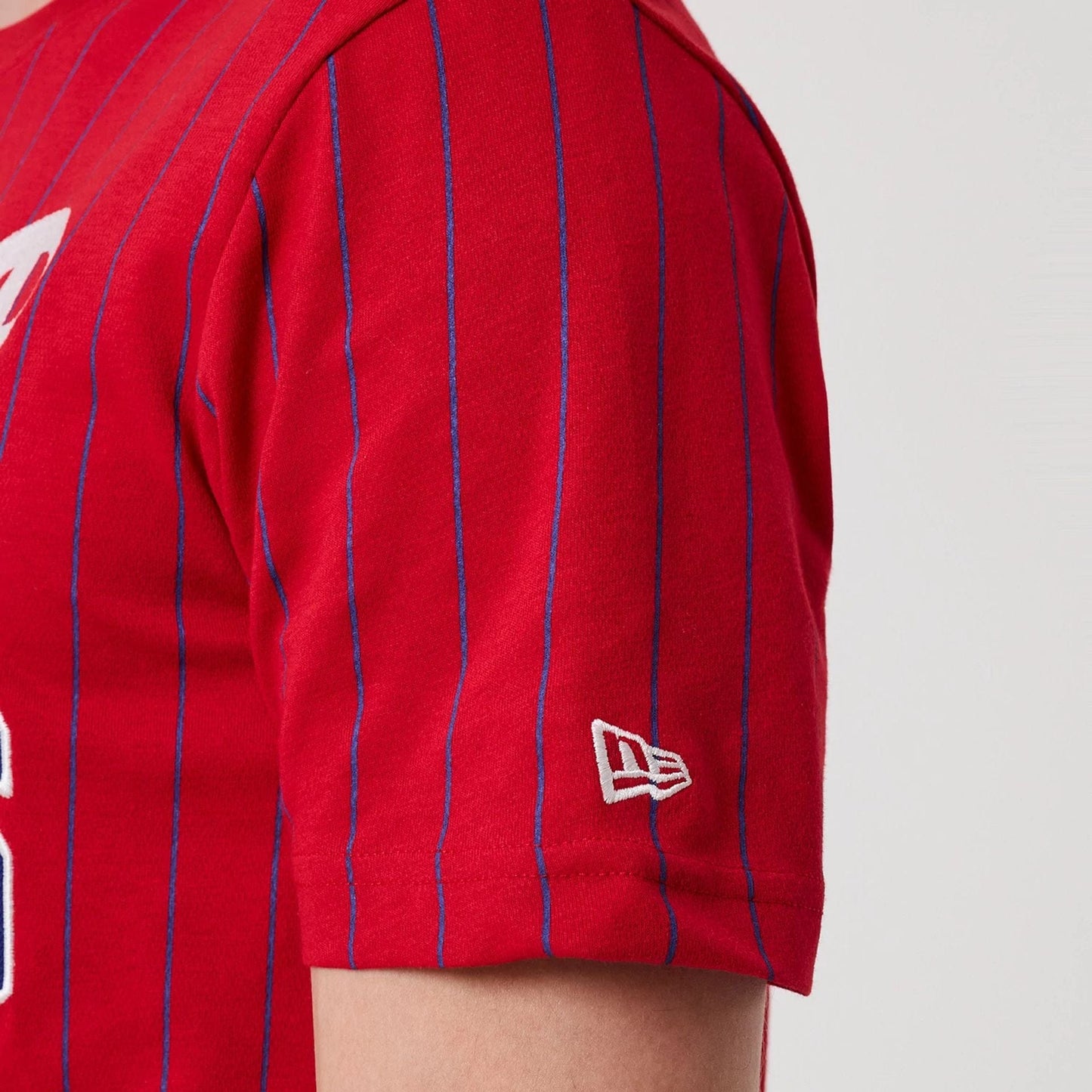The model is wearing this MLB Pinstripe Philadelphia Phillies T-Shirt in red. 5