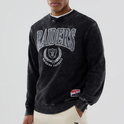 The model is wearing this NFL Las Vegas Raiders Laurel Wreath Crew Neck Sweater in black. 4
