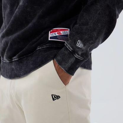 The model is wearing this NFL Las Vegas Raiders Crew Neck Sweater in black. 5