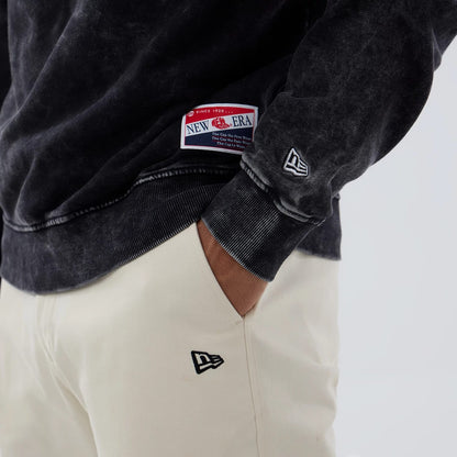 The model is wearing this NFL Las Vegas Raiders Laurel Wreath Crew Neck Sweater in black. 5