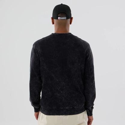 The model is wearing this NFL Las Vegas Raiders Crew Neck Sweater in black. 2