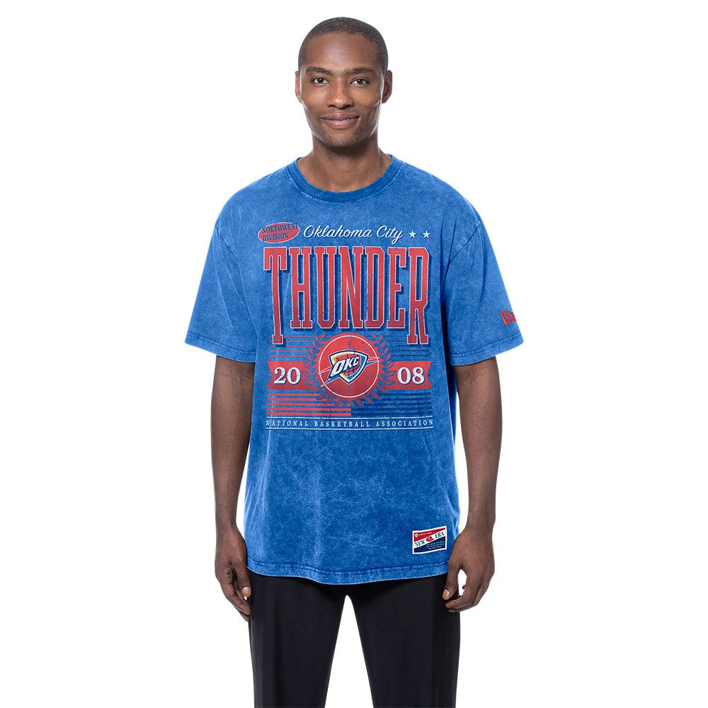New Era Oklahoma City Thunder NBA Blue T-Shirt, front view on-model revealing red Thunder lettering and OKC logo printed across the chest, with year 2008 displayed, complemented by short sleeves and a crew neckline.