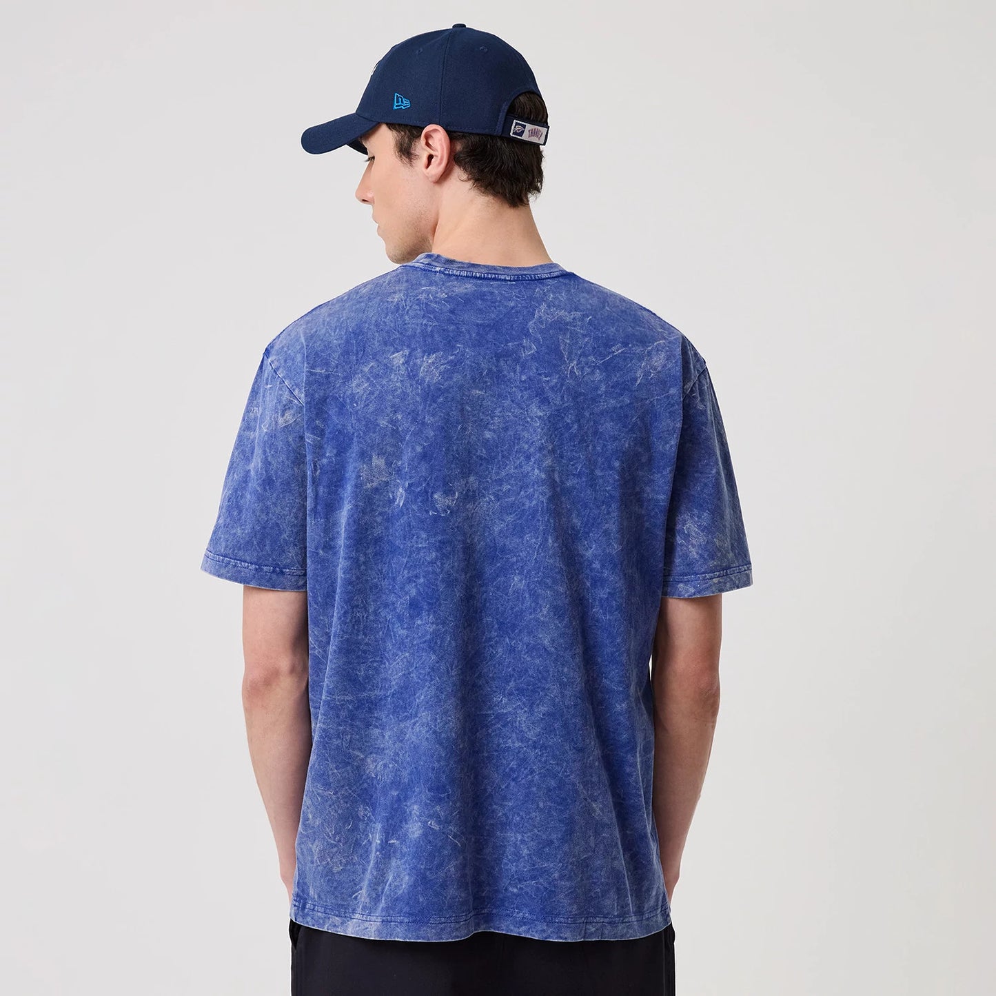 The model is wearing this NBA Oklahoma City Thunder T-Shirt in blue. 2
