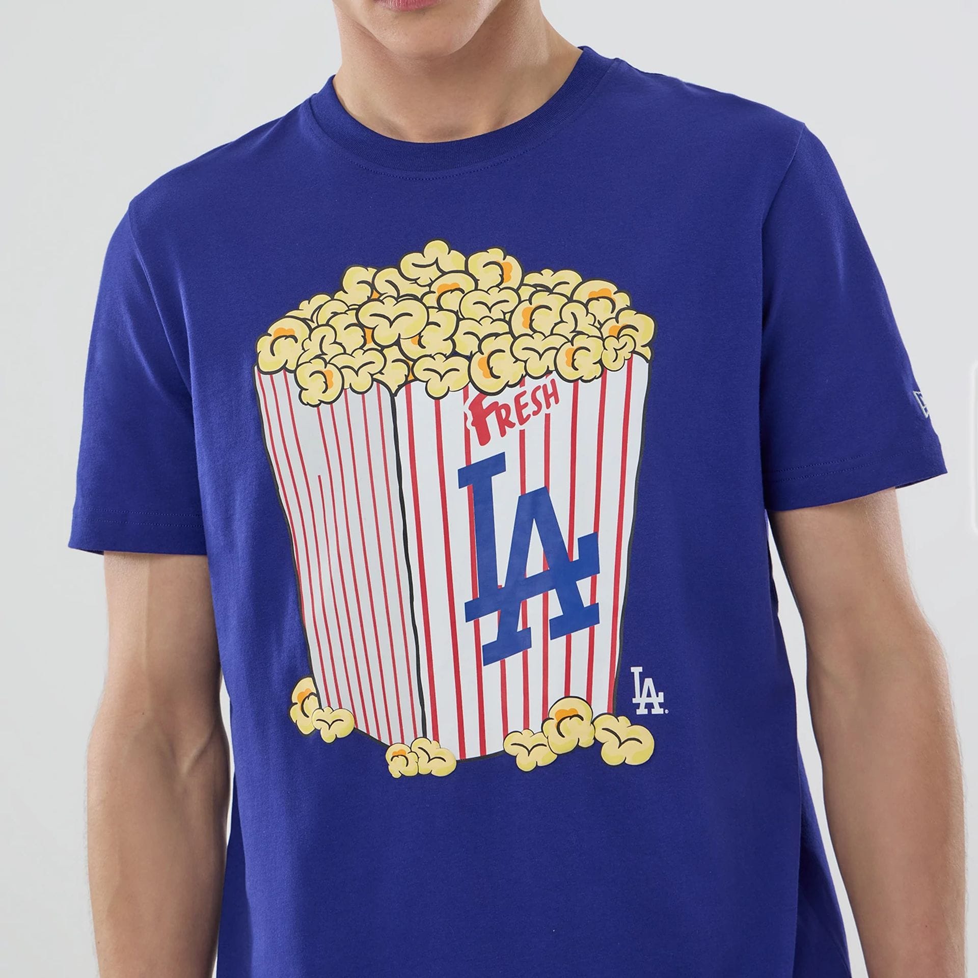 The model is wearing this MLB Popcorn LA Dodgers T-Shirt in dark blue. 5
