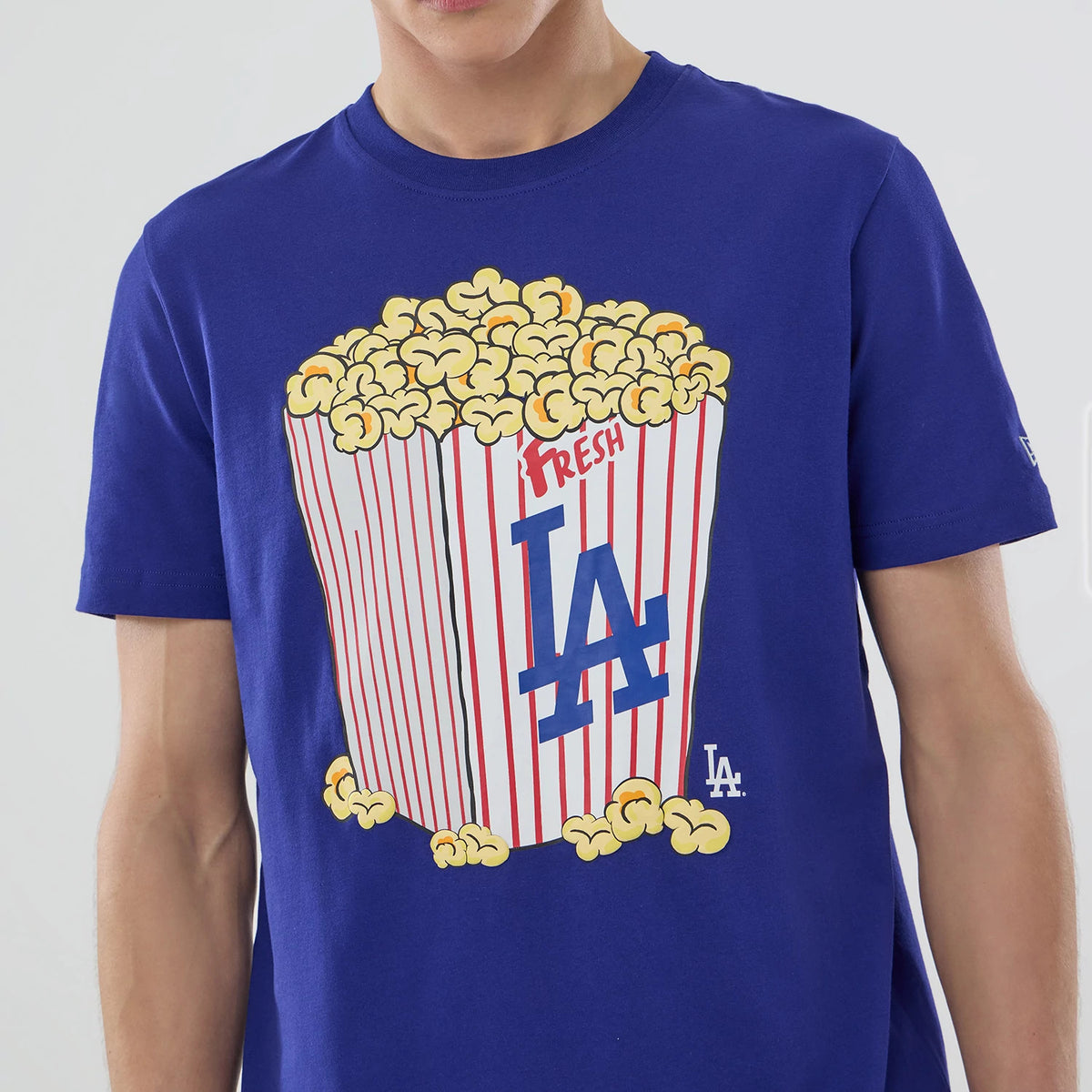 The model is wearing this MLB Popcorn LA Dodgers T-Shirt in dark blue. 5