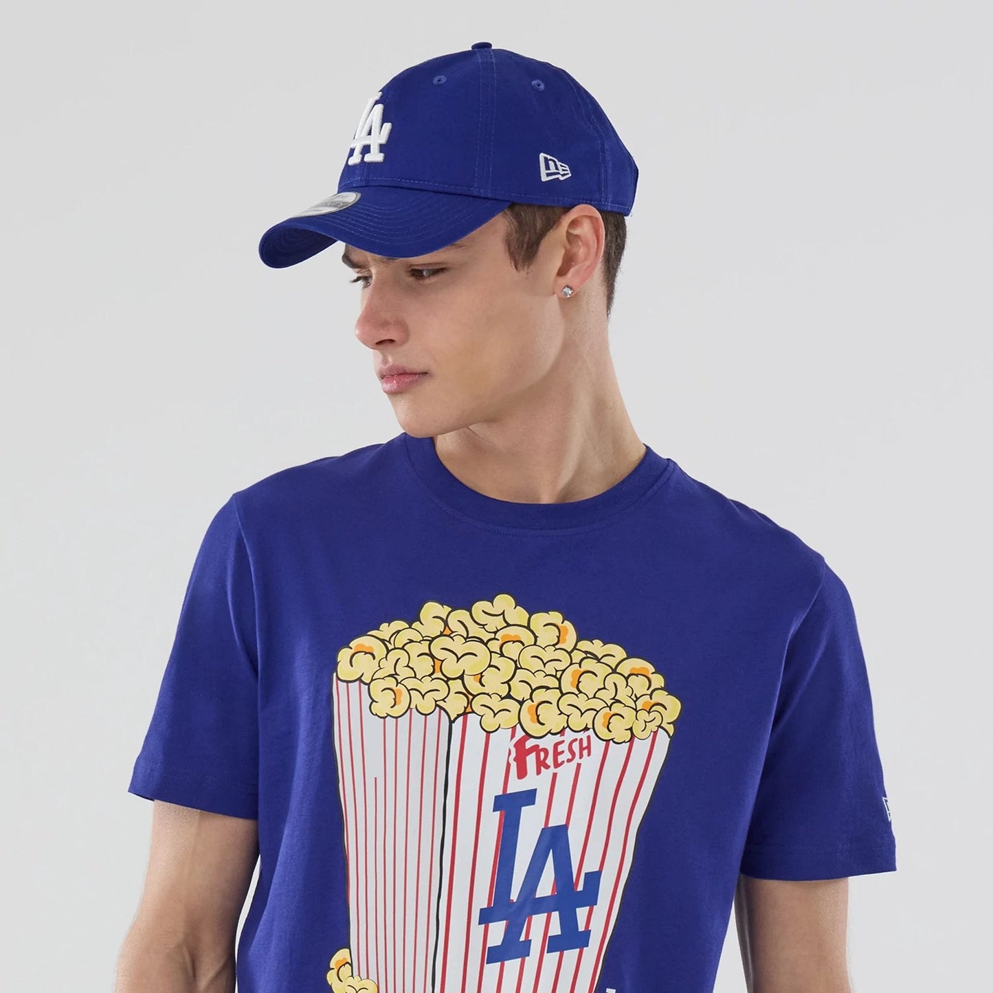 The model is wearing this MLB Popcorn LA Dodgers T-Shirt in dark blue. 6