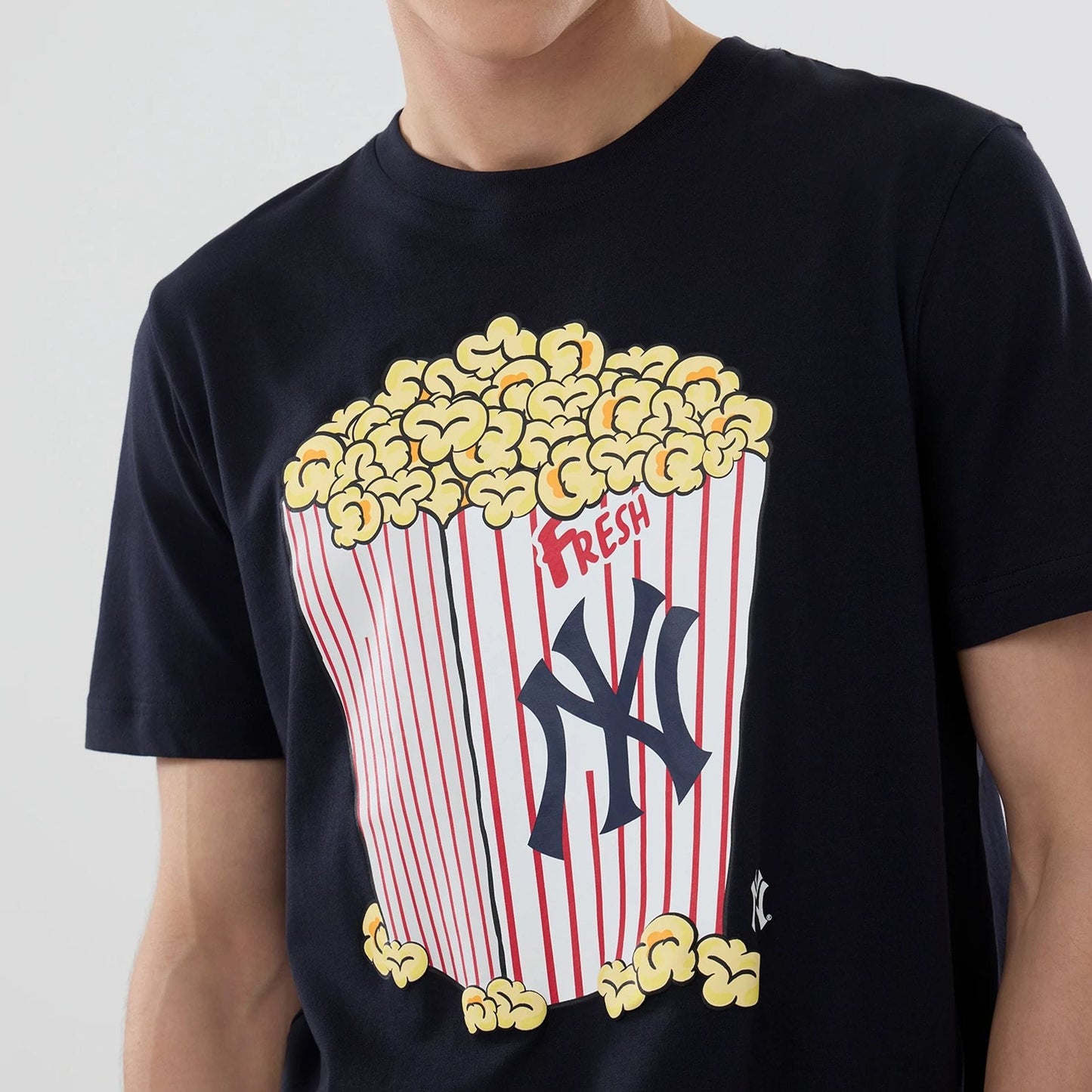 The model is wearing this MLB Popcorn New York Yankees T-Shirt in navy. 5