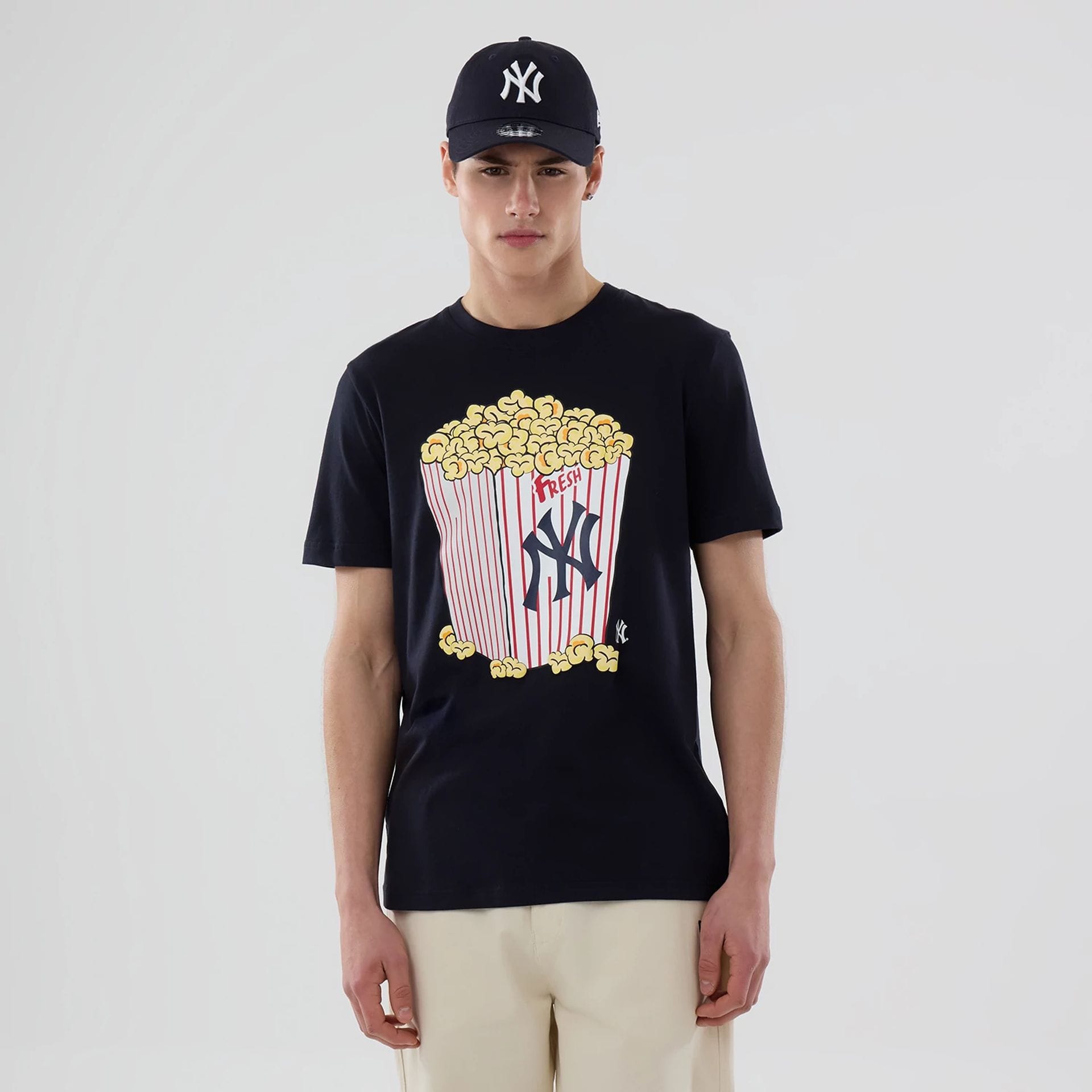 The model is wearing this MLB Popcorn New York Yankees T-Shirt in navy. 1
