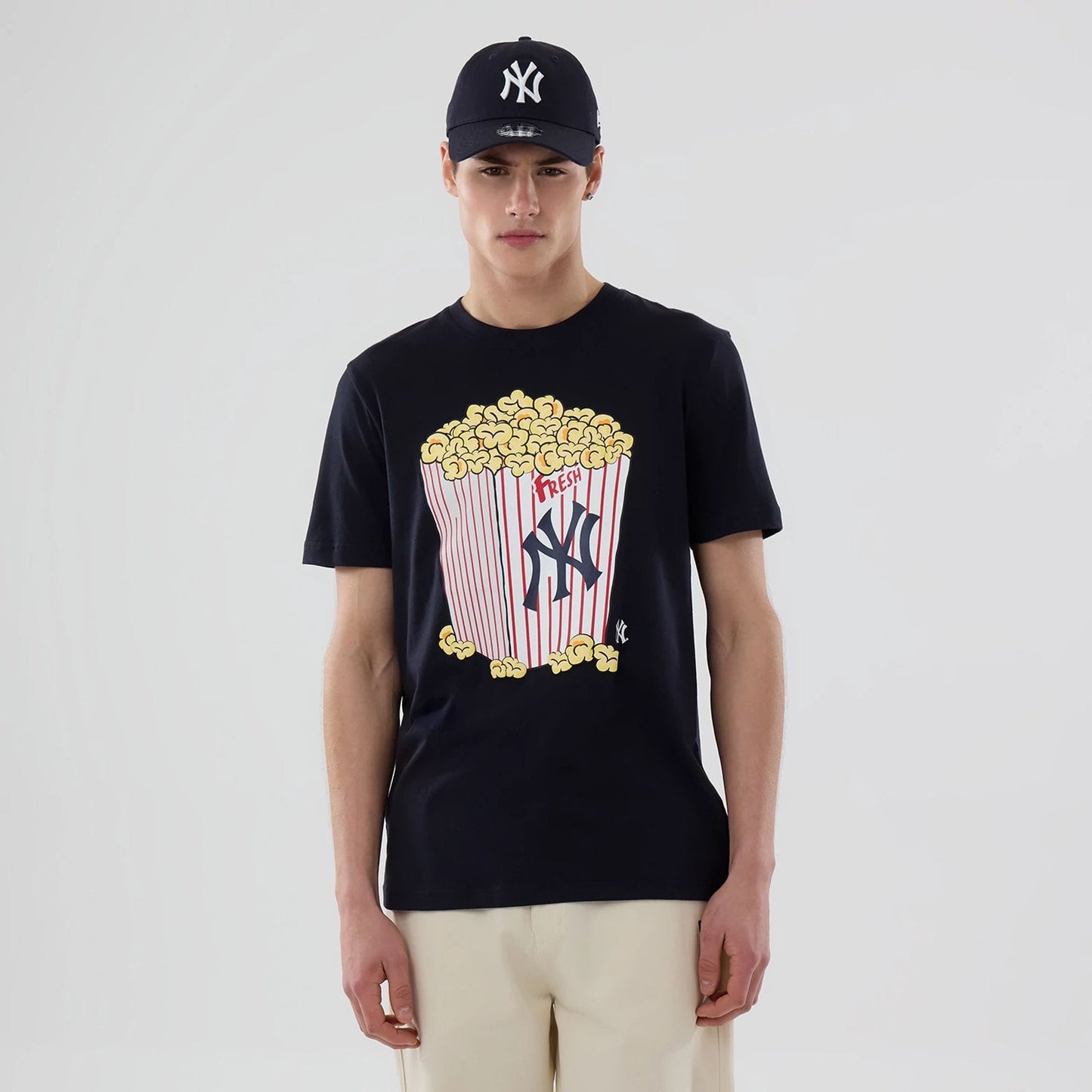 The model is wearing this MLB Popcorn New York Yankees T-Shirt in navy. 1