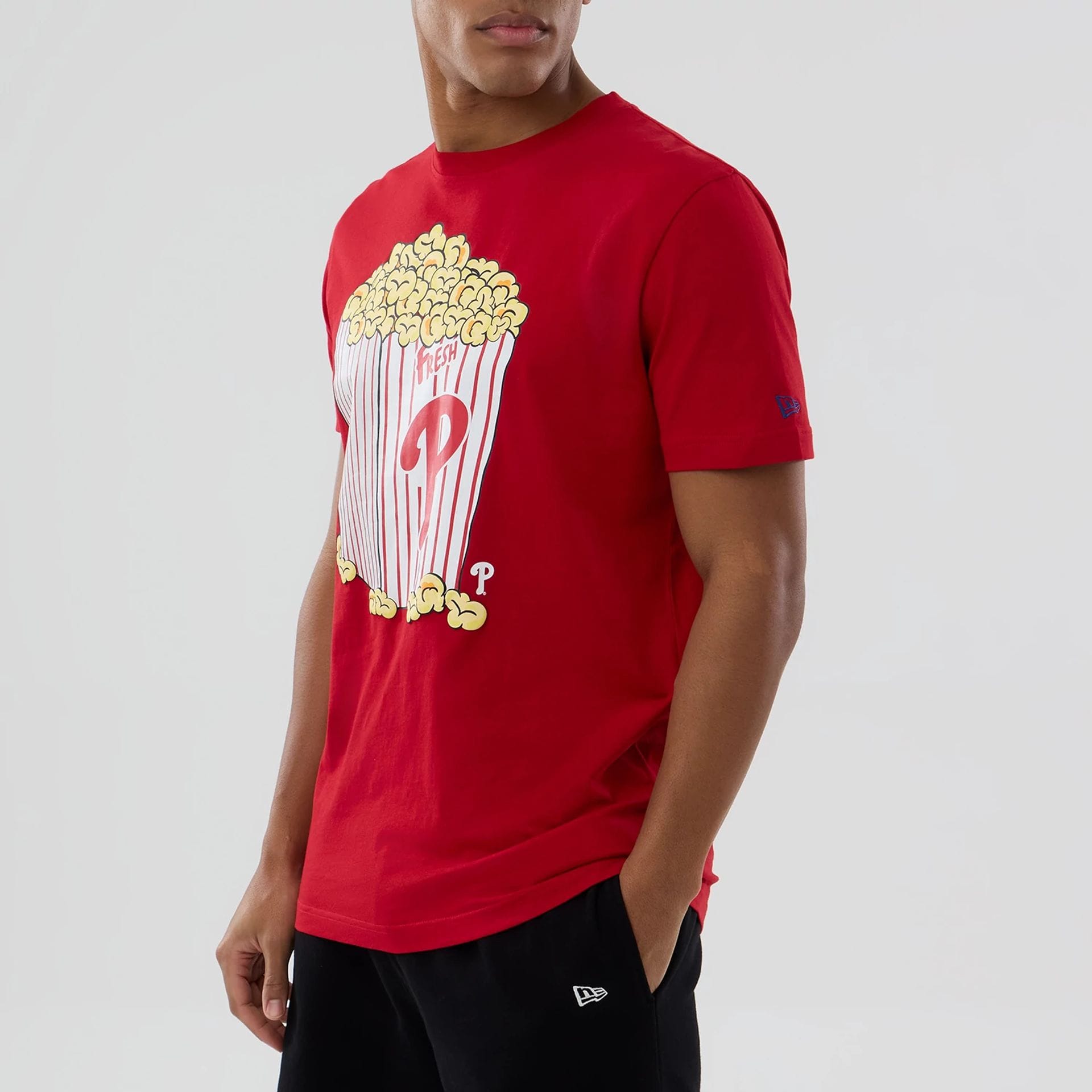 The model is wearing this MLB Popcorn Philadelphia Phillies T-Shirt in red. 5