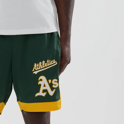 The model is wearing these MLB Athletics Mesh Shorts in dark green. 5