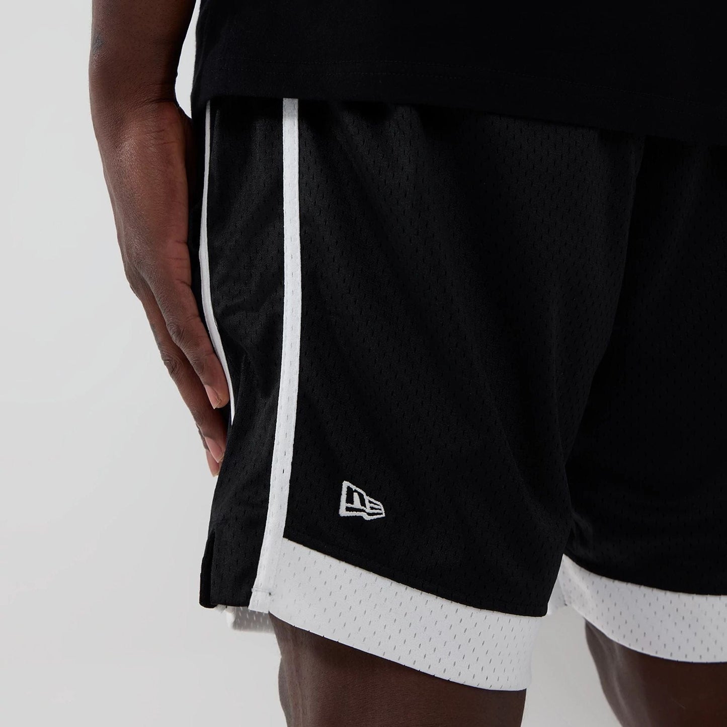 The model is wearing these NBA Chicago Bulls Mesh Shorts in black. 4