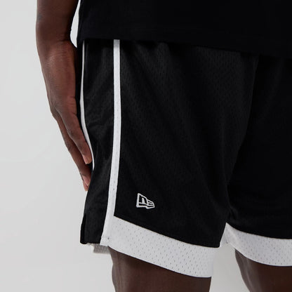 The model is wearing these NBA Chicago Bulls Mesh Shorts in black. 4