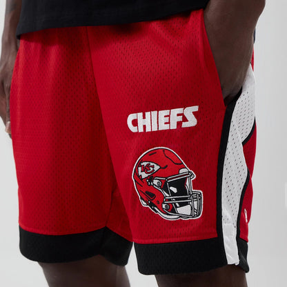 The model is wearing these NFL Kansas City Chiefs Mesh Shorts in red. 2