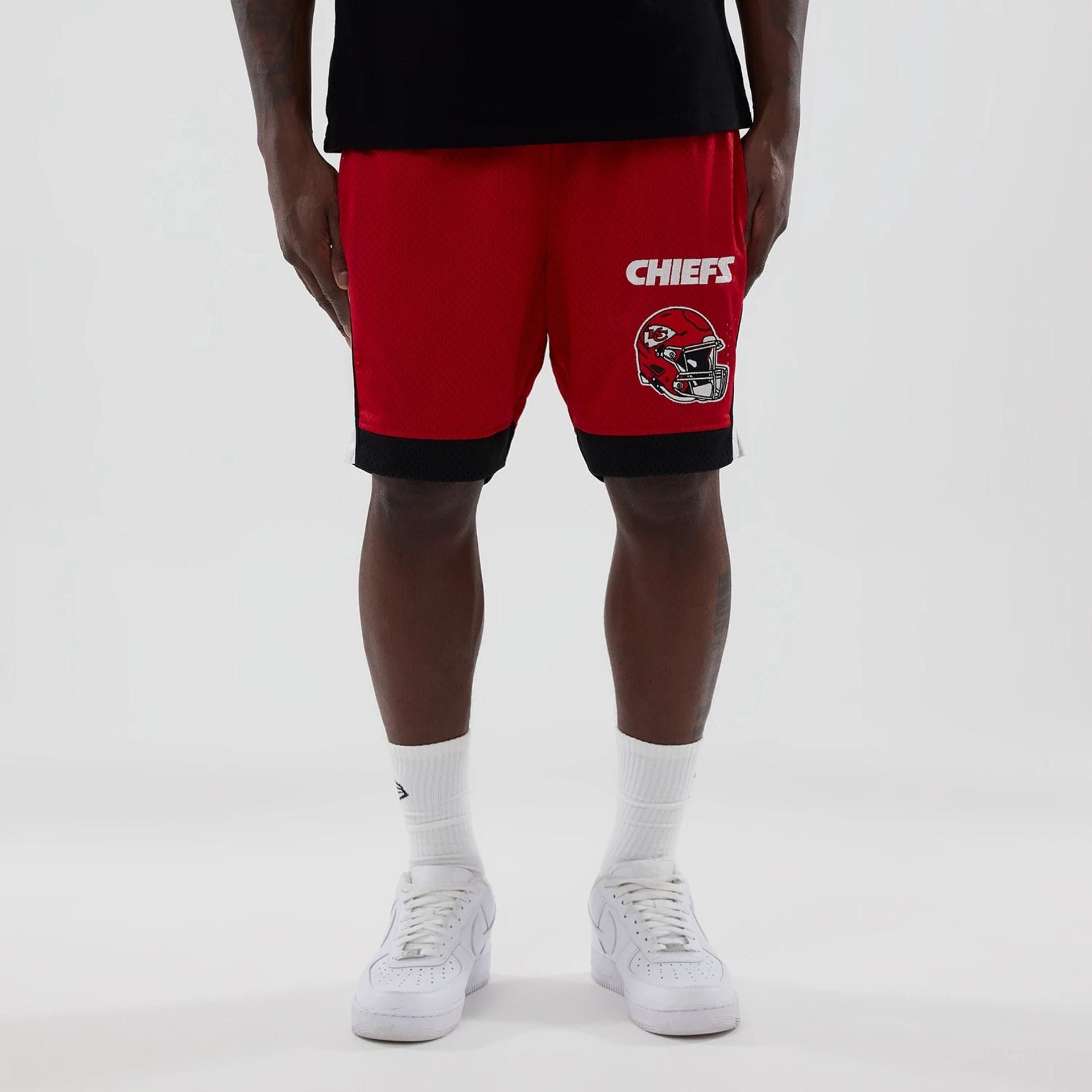 The model is wearing these NFL Kansas City Chiefs Mesh Shorts in red. 1