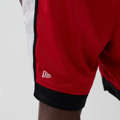 New Era Kansas City Chiefs NFL Red Mesh Shorts, three-quarter view showing the red mesh fabric with a contrasting white side stripe and black hem, featuring a white embroidered New Era logo near the bottom edge.