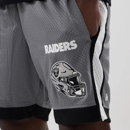 The model is wearing these NFL Las Vegas Raiders Mesh Shorts in grey. 3
