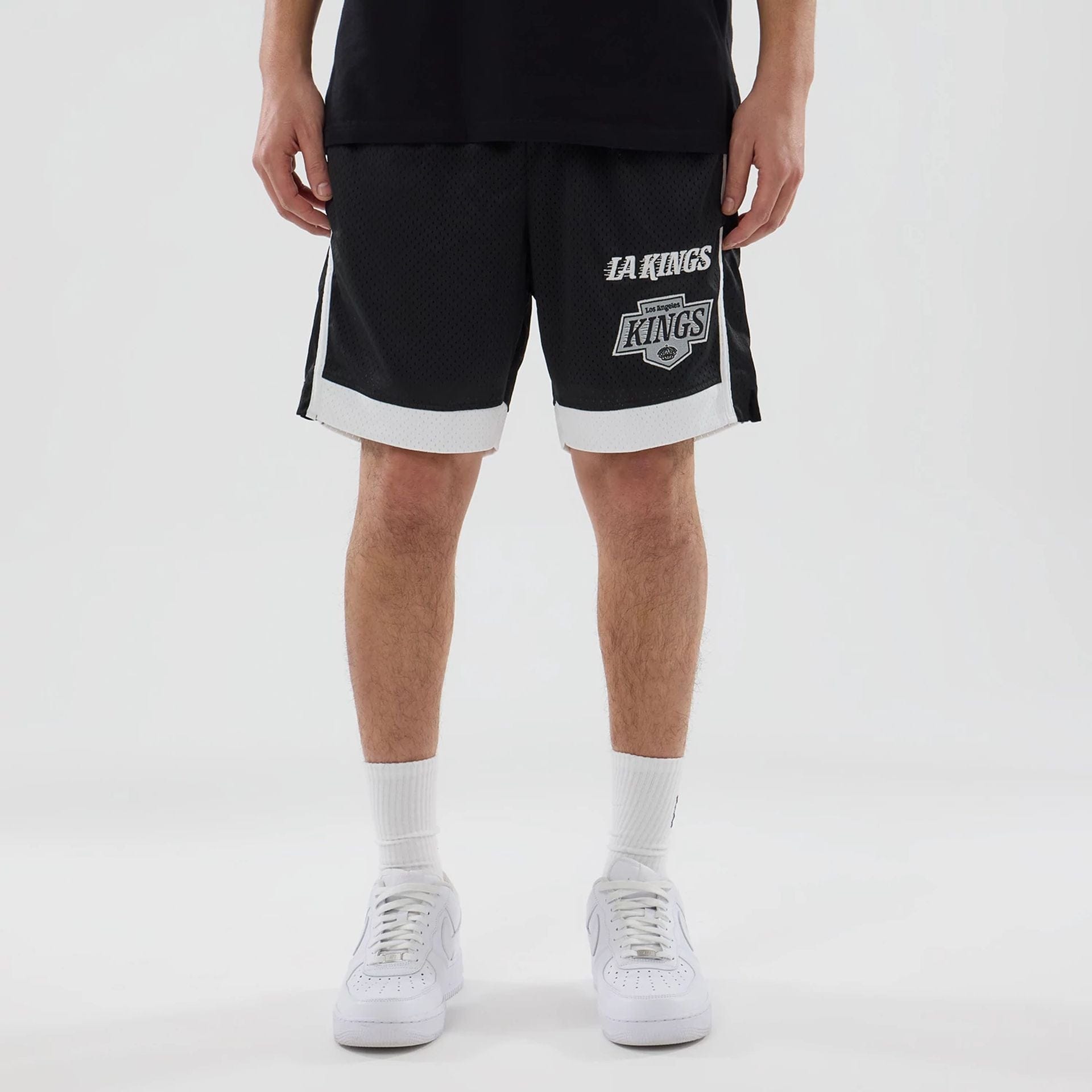 The model is wearing these NHL LA Kings Mesh Shorts in black. 1
