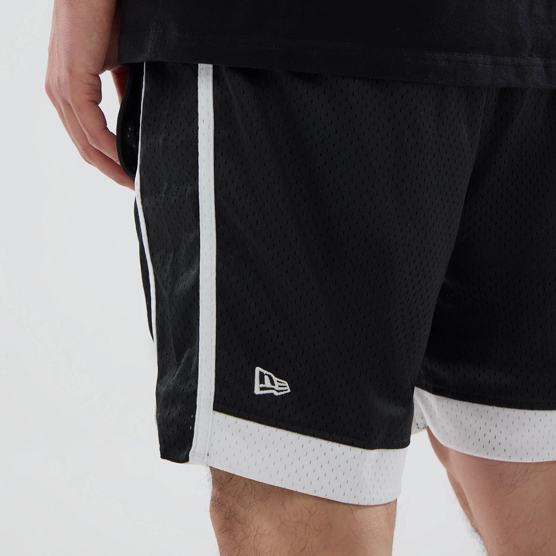 The model is wearing these NHL LA Kings Mesh Shorts in black. 3