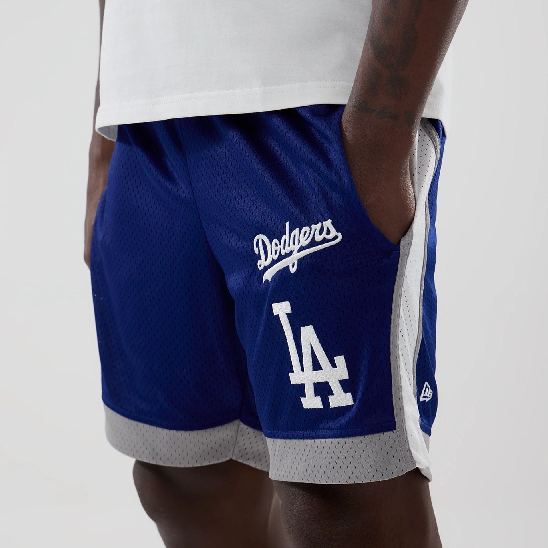 The model is wearing these MLB LA Dodgers Mesh Shorts in dark blue. 5