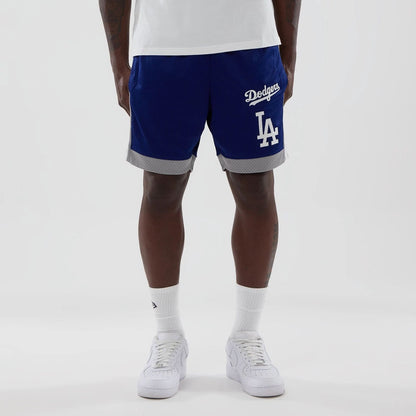 The model is wearing these MLB LA Dodgers Mesh Shorts in dark blue. 1