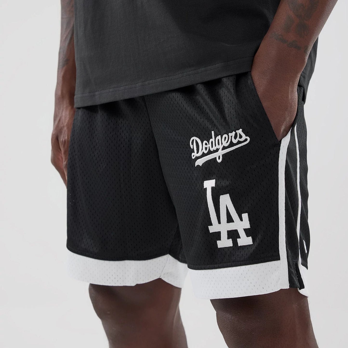 The model is wearing these MLB LA Dodgers Mesh Shorts in black. 3