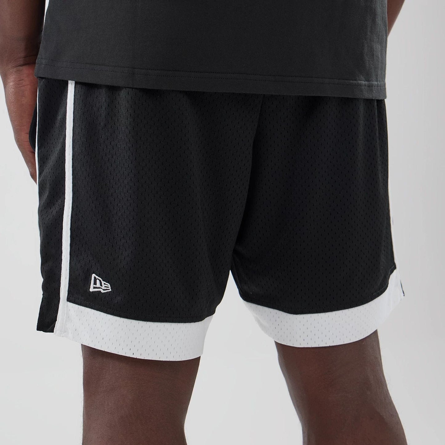 The model is wearing these MLB LA Dodgers Mesh Shorts in black. 4