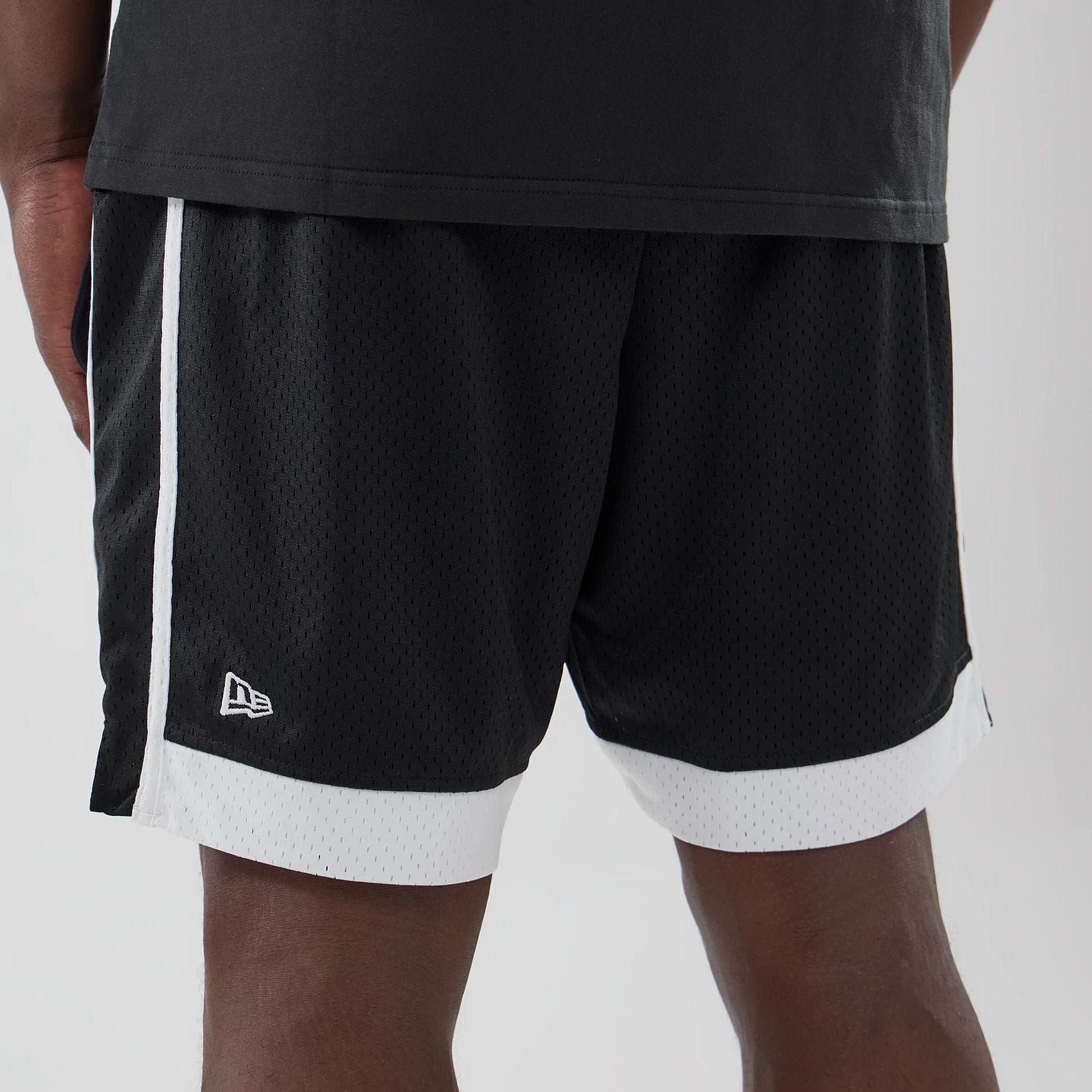 The model is wearing these MLB LA Dodgers Mesh Shorts in black. 4