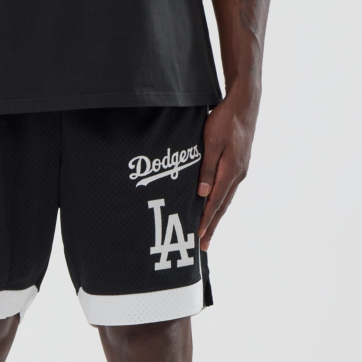 The model is wearing these MLB LA Dodgers Mesh Shorts in black. 5