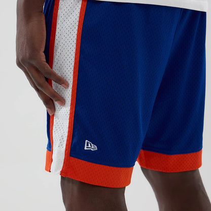 The model is wearing these MLB New York Mets Mesh Shorts in blue. 4
