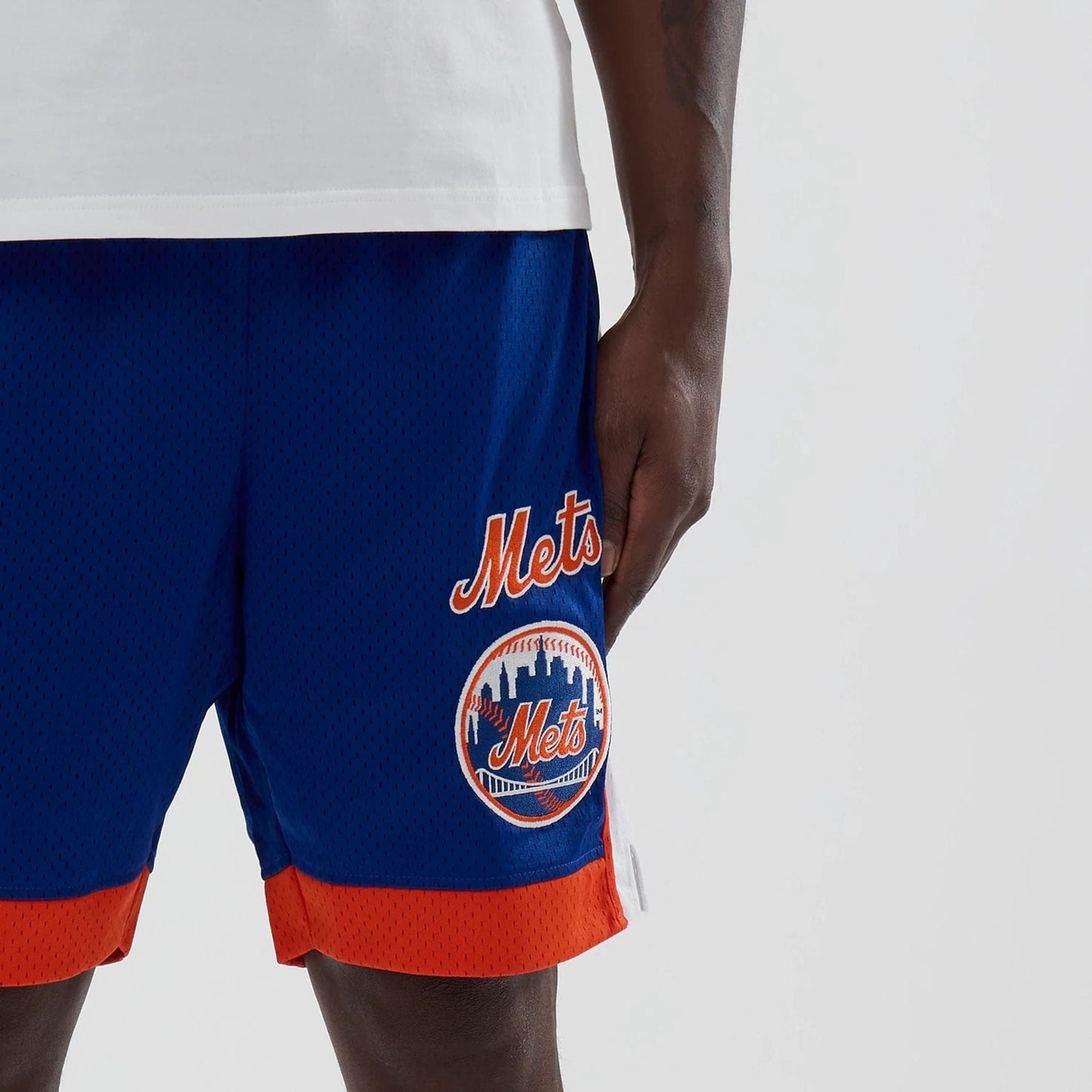 The model is wearing these MLB New York Mets Mesh Shorts in blue. 5