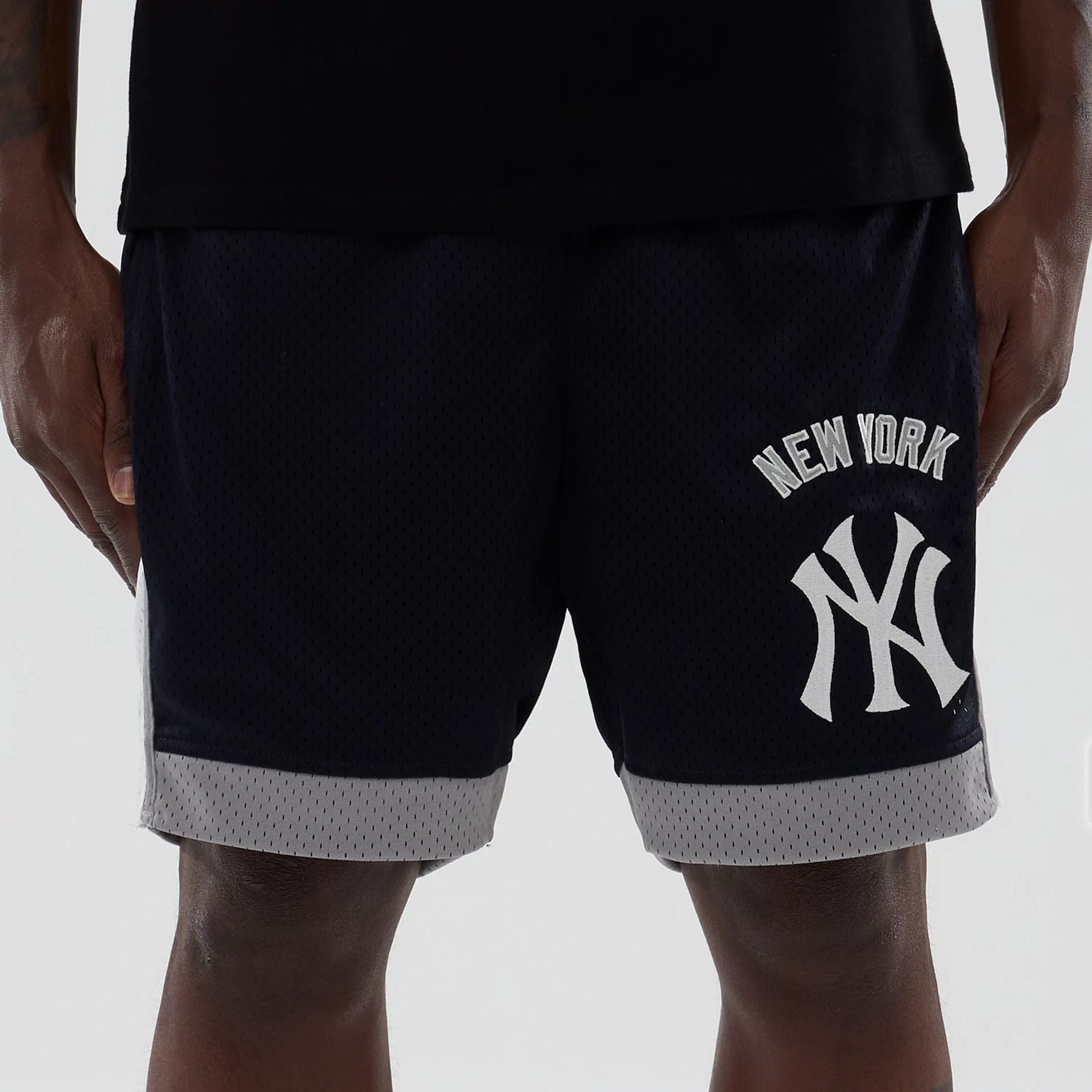 The model is wearing these MLB New York Yankees Mesh Shorts in navy. 2