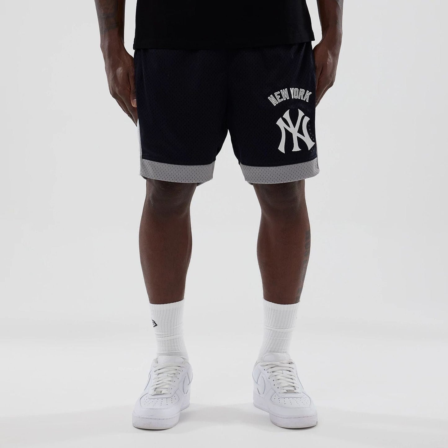 The model is wearing these MLB New York Yankees Mesh Shorts in navy. 1