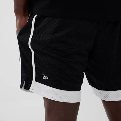 The model is wearing these MLB New York Yankees Mesh Shorts in black. 4