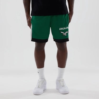 The model is wearing these NFL Philadelphia Eagles Mesh Shorts in green. 1